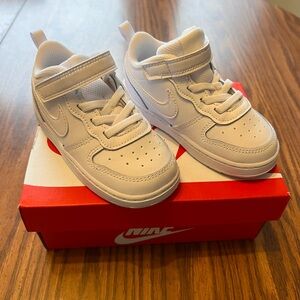 NWT Kids Nike court borough low 2. Size 8c. Never worn. All white
